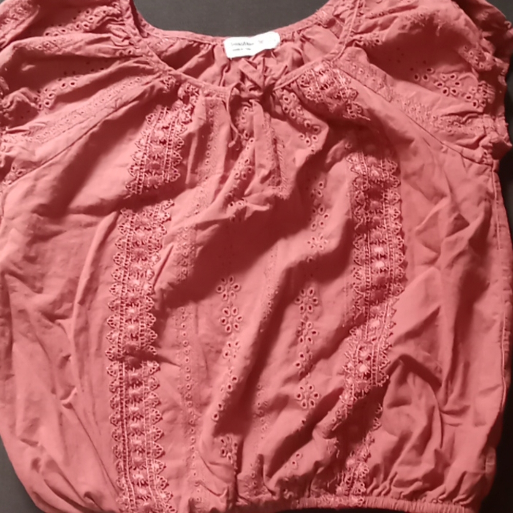 A crop top borded of flowers